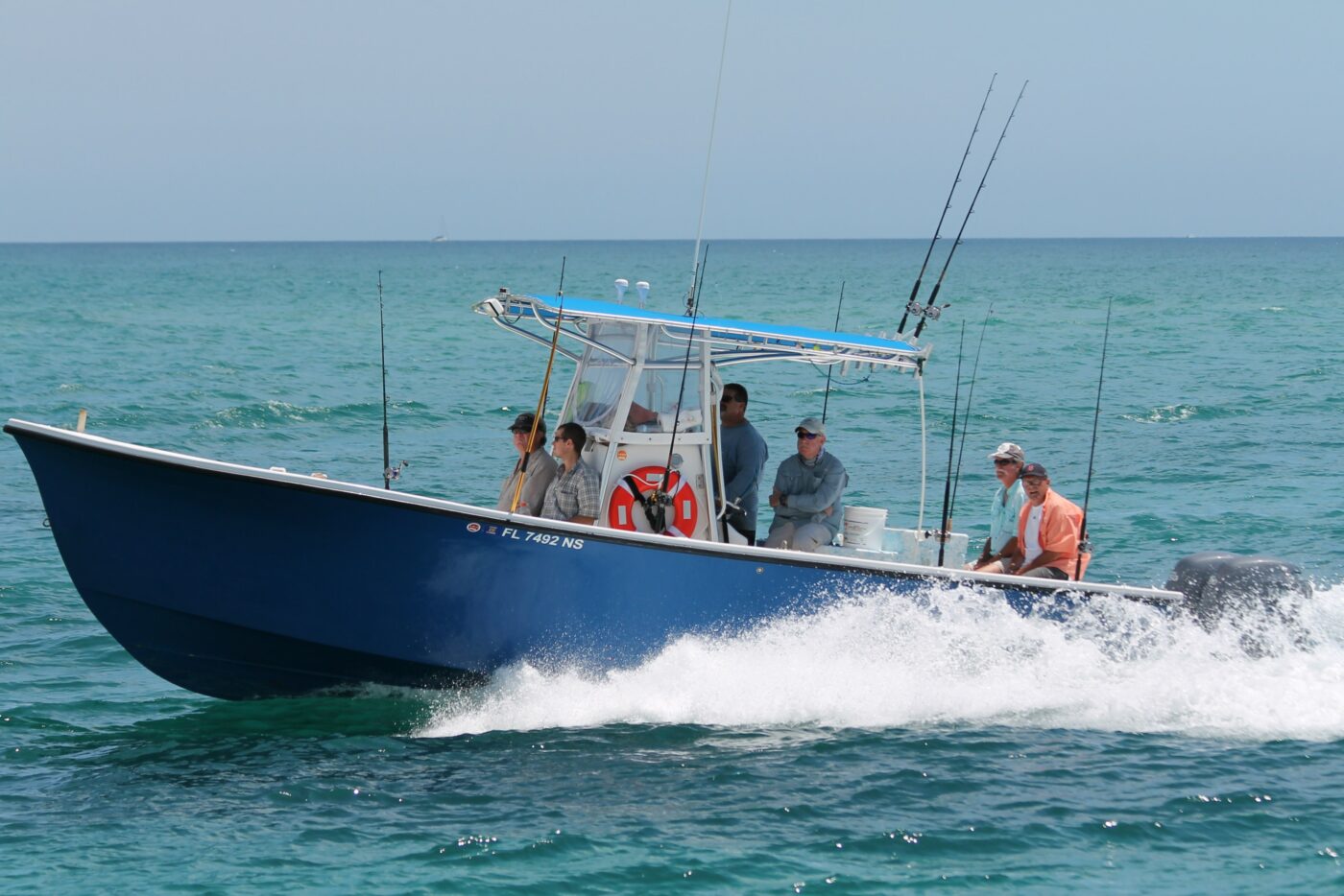 A charter captain takes his crew out on a blue center console.